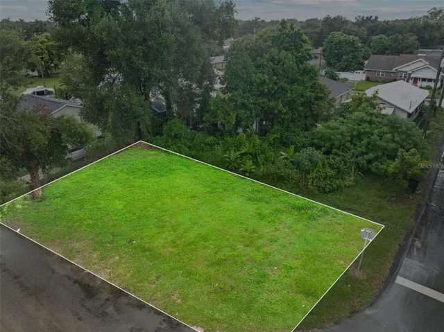 a view of a backyard with a lake view