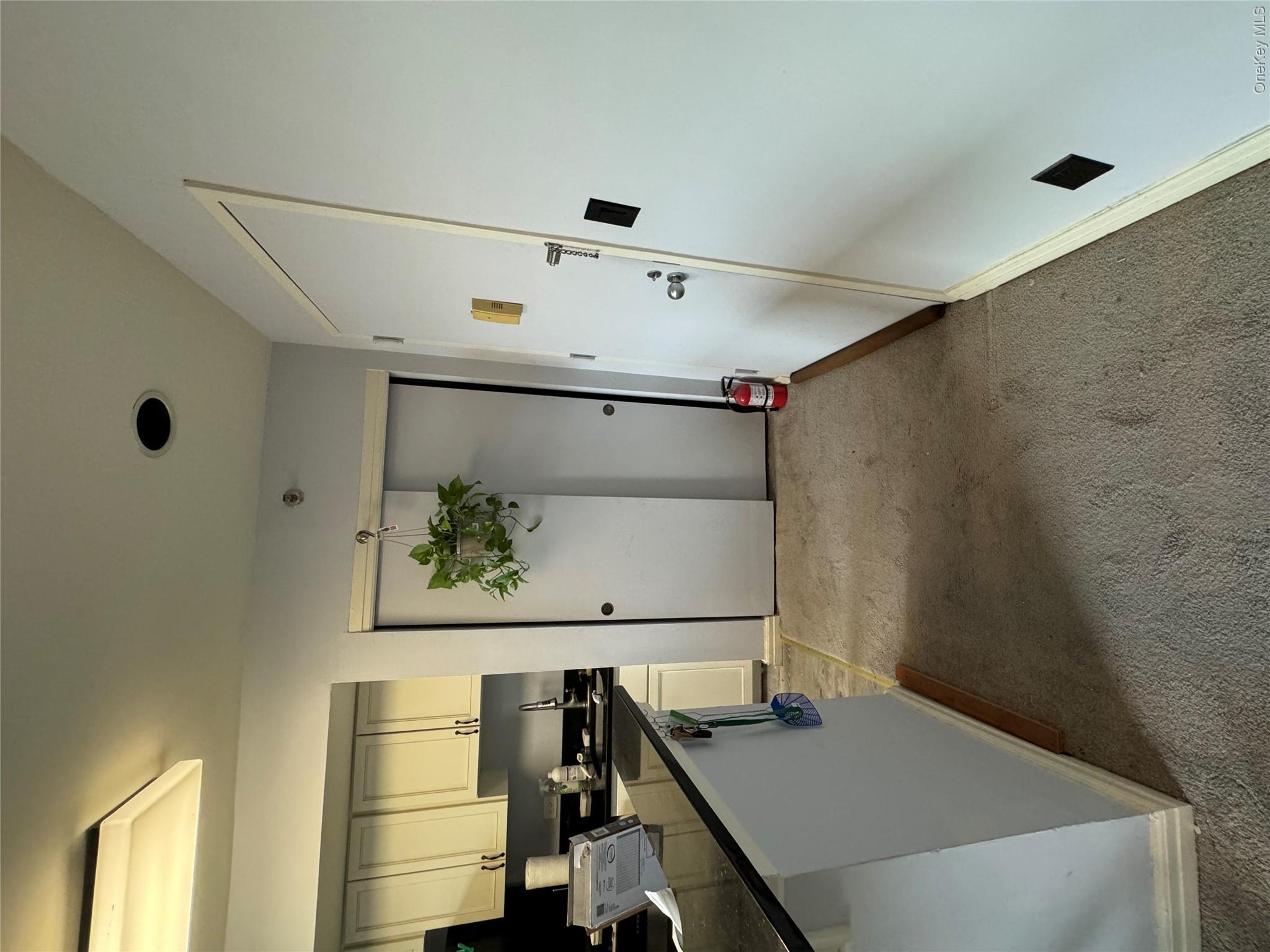 1701 Crompond Road, Unit 6313 Peekskill, NY 10566 - Photo 5 of 13 a kitchen with stainless steel appliances a refrigerator a sink a stove and white cabinets