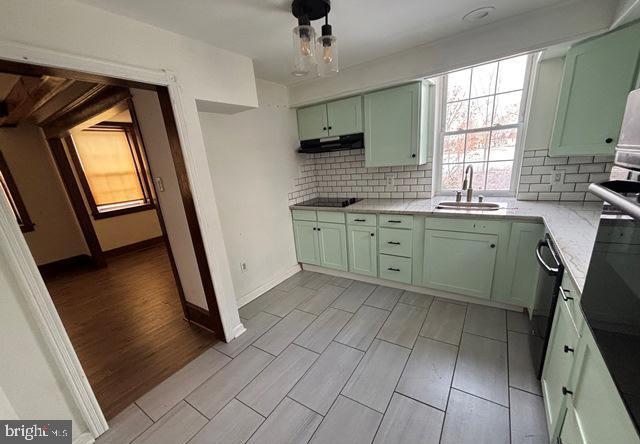137 Repaupo Station Road Swedesboro, NJ 08085 - Photo 9 of 17 a kitchen with granite countertop a sink a stove a washer dryer and a view of living room