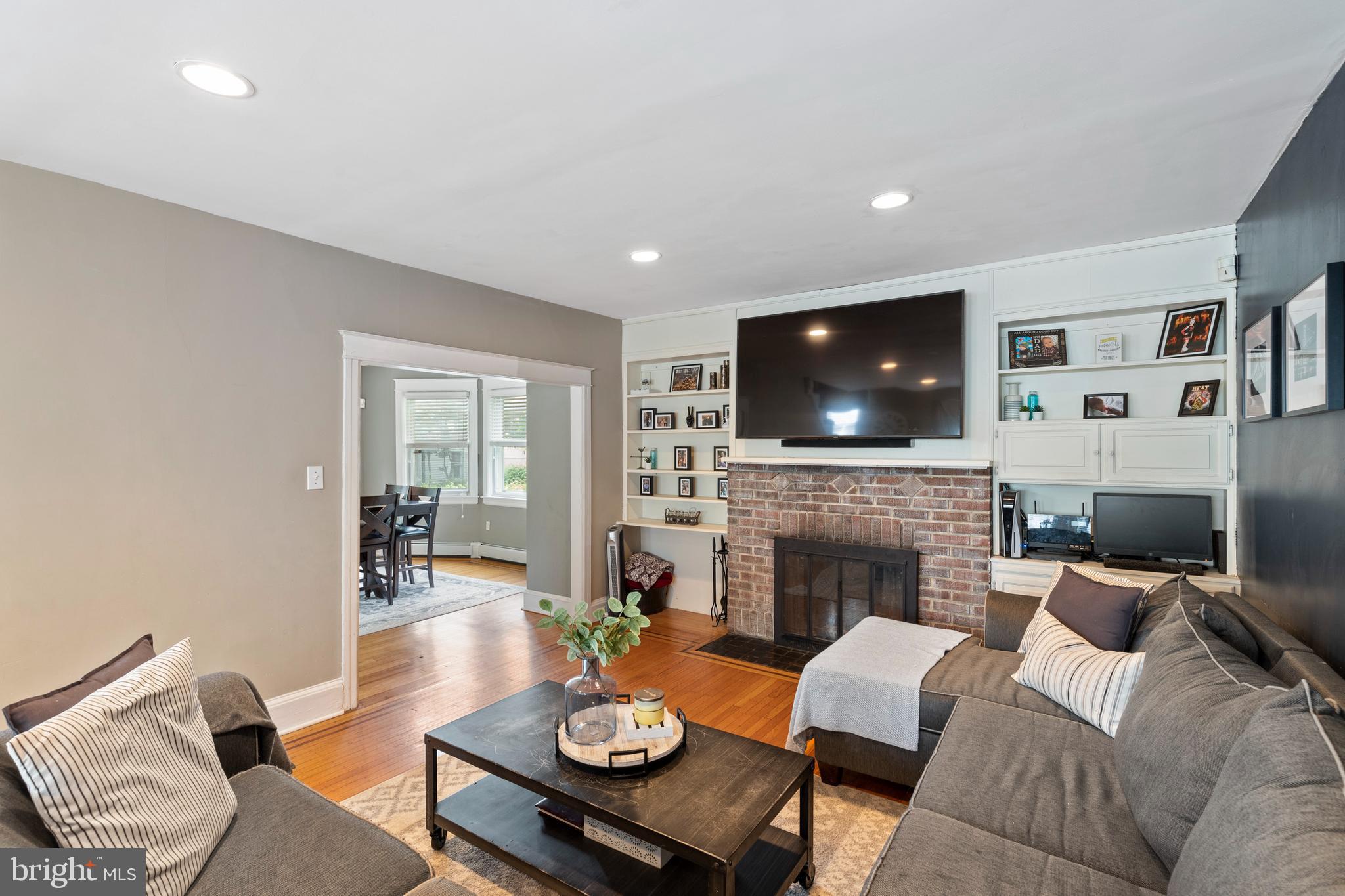 312 South State Road Upper Darby, PA 19082 - Photo 13 of 37 a living room with furniture flat screen tv and a fireplace