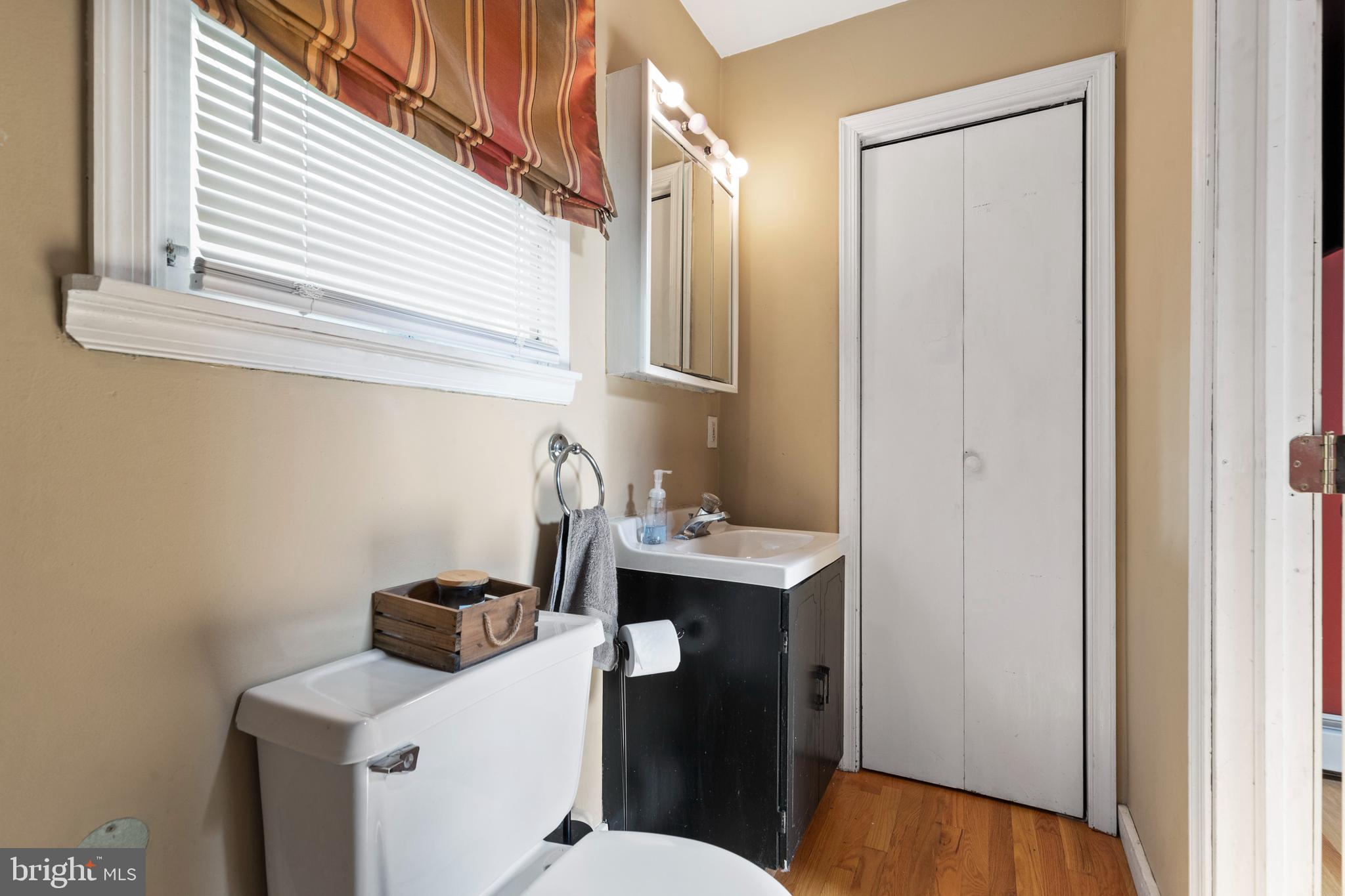 312 South State Road Upper Darby, PA 19082 - Photo 15 of 37 a bathroom with a sink a toilet and mirror