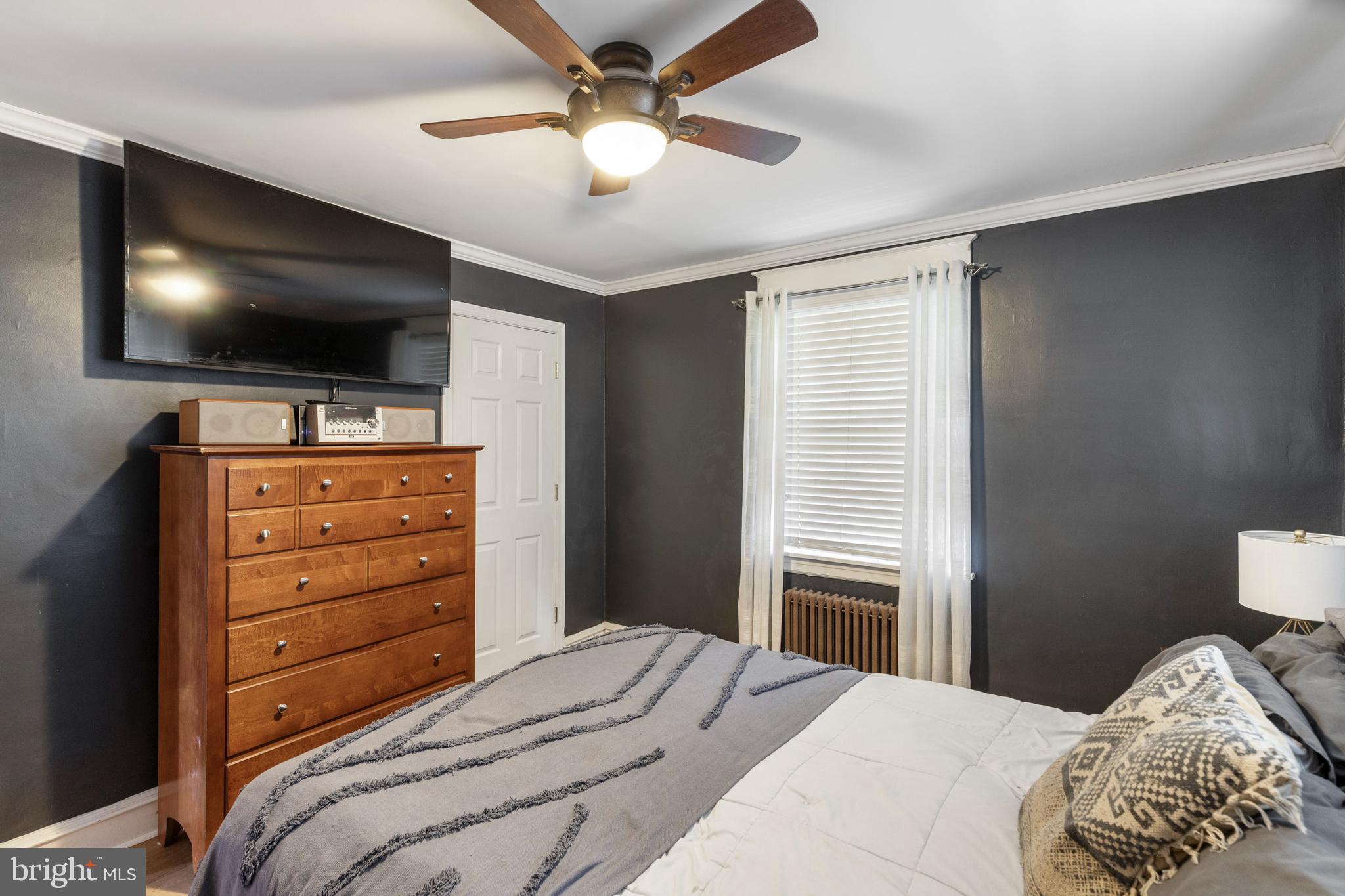 312 South State Road Upper Darby, PA 19082 - Photo 24 of 37 a bedroom with a bed and a flat screen tv