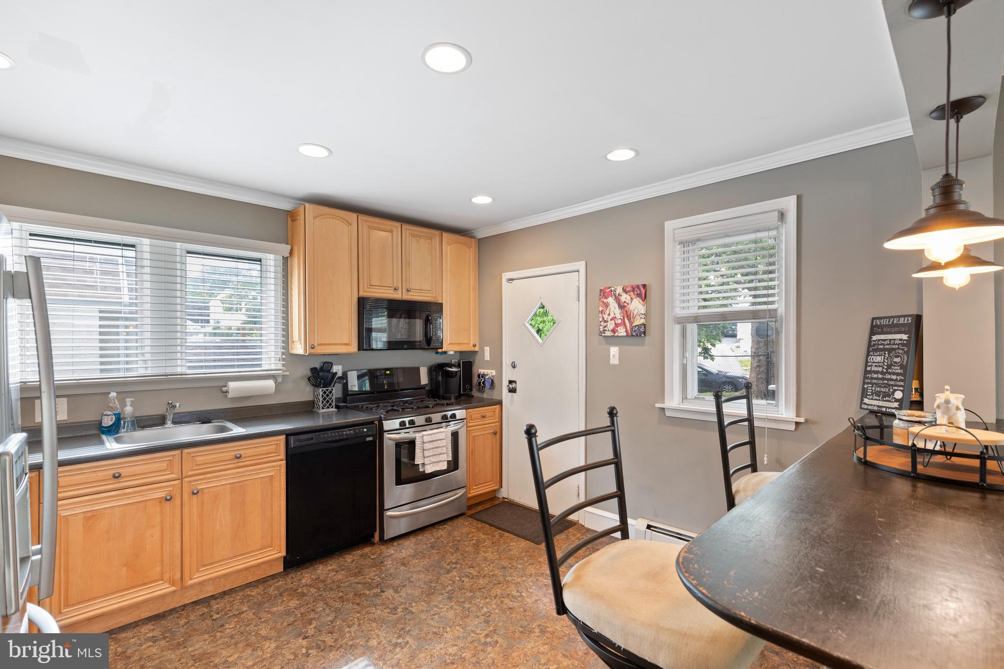 312 South State Road Upper Darby, PA 19082 - Photo 4 of 37 a kitchen with stainless steel appliances granite countertop sink stove top oven and cabinets