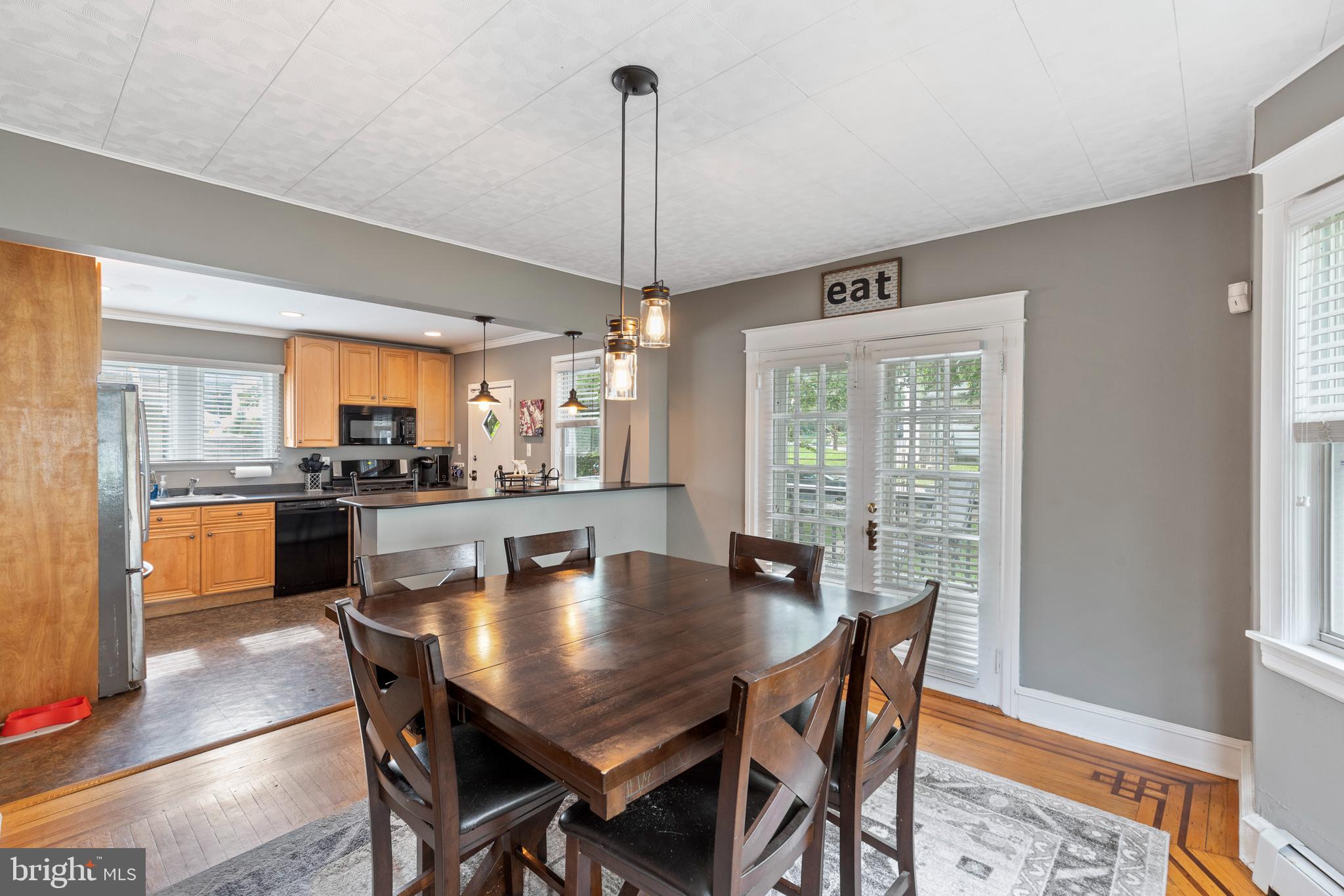 312 South State Road Upper Darby, PA 19082 - Photo 6 of 37 a dining room with furniture a chandelier and wooden floor