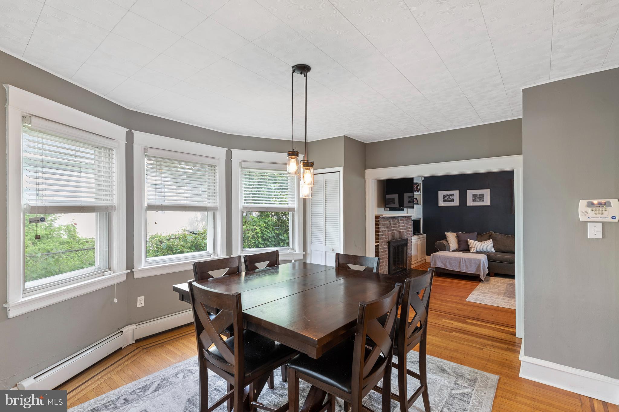 312 South State Road Upper Darby, PA 19082 - Photo 8 of 37 a dining room with furniture wooden floor a chandelier and a rug