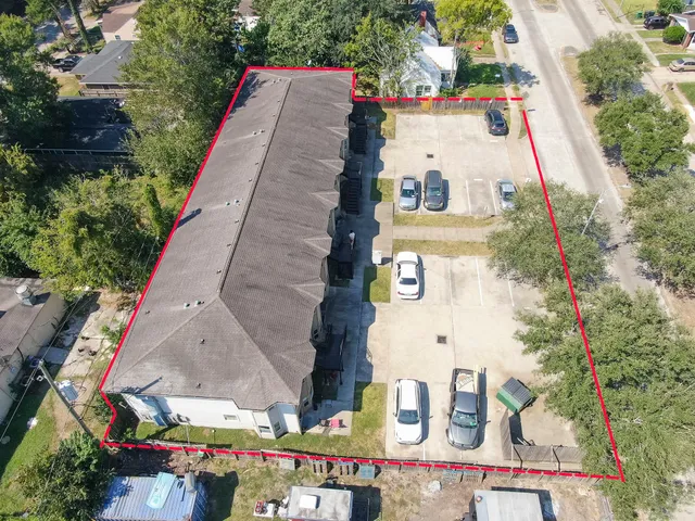 an aerial view of a house with outdoor space