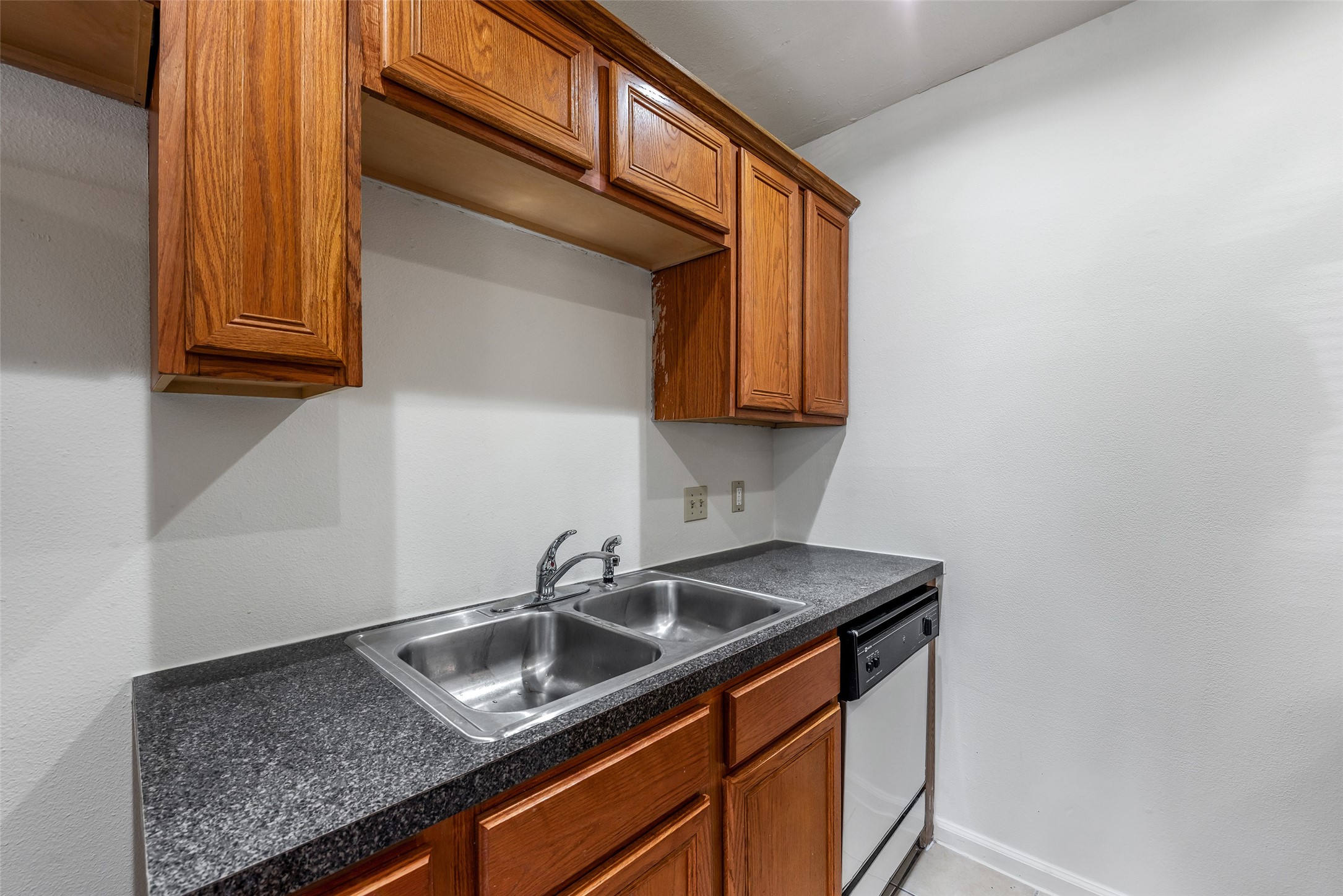 3238 Alabama Street, Unit 2 Houston, TX 77004 - Photo 7 of 15 a kitchen with stainless steel appliances granite countertop a sink stove and cabinets