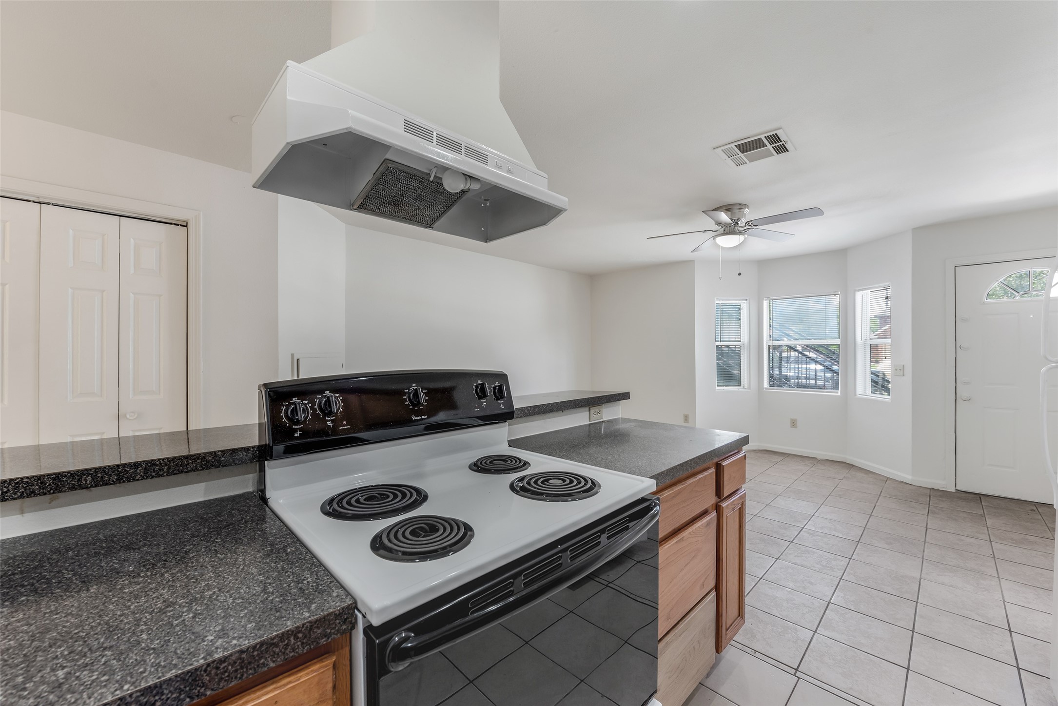 3238 Alabama Street, Unit 2 Houston, TX 77004 - Photo 8 of 15 a kitchen with a stove a sink and a refrigerator