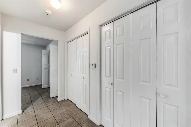 a view of a livingroom with bathroom space