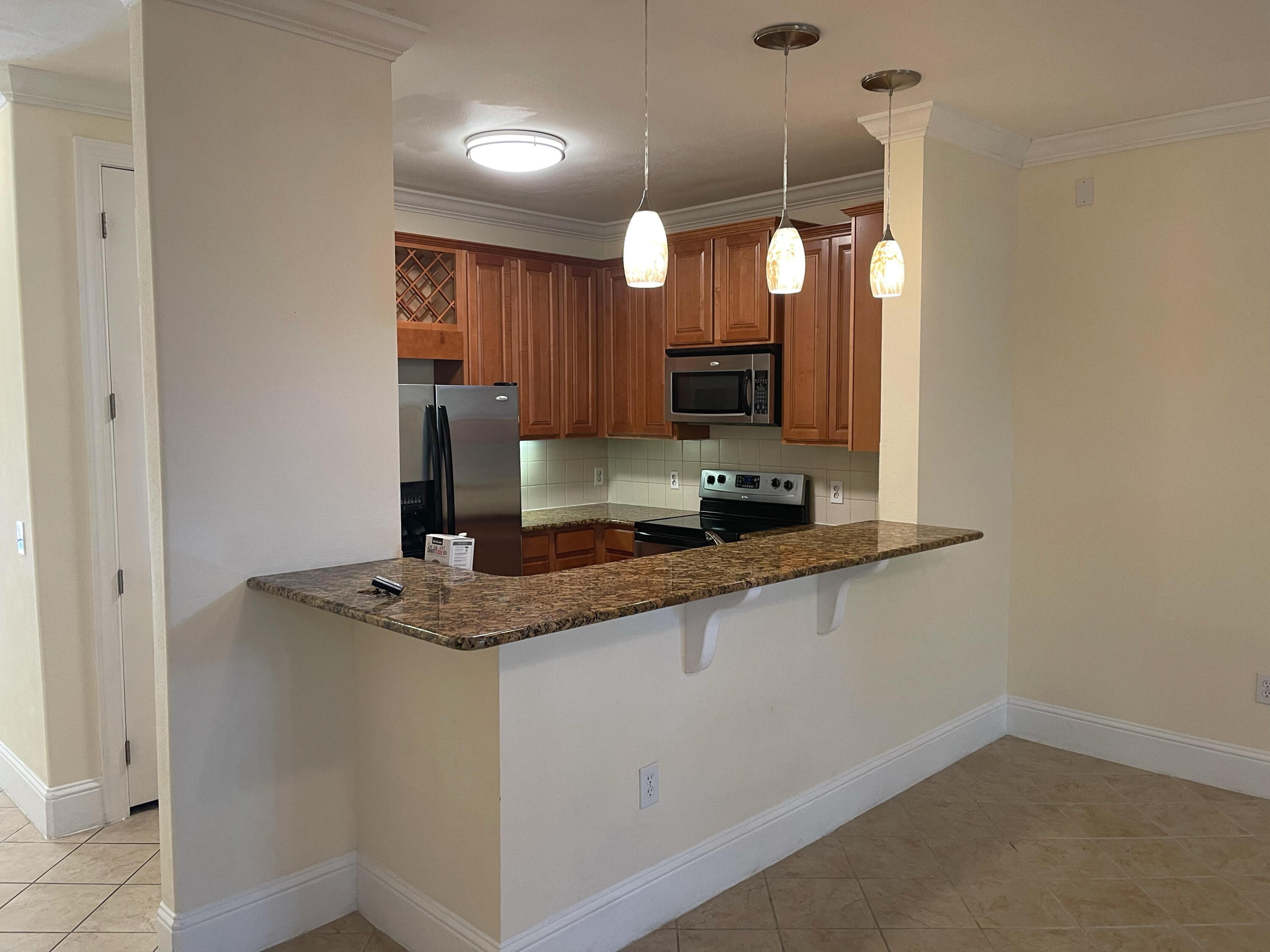 17 Bald Eagle Court Santa Rosa Beach, FL 32459 - Photo 2 of 5 a kitchen with stainless steel appliances granite countertop a sink and a granite counter tops
