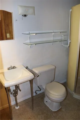 a view of garage with cars