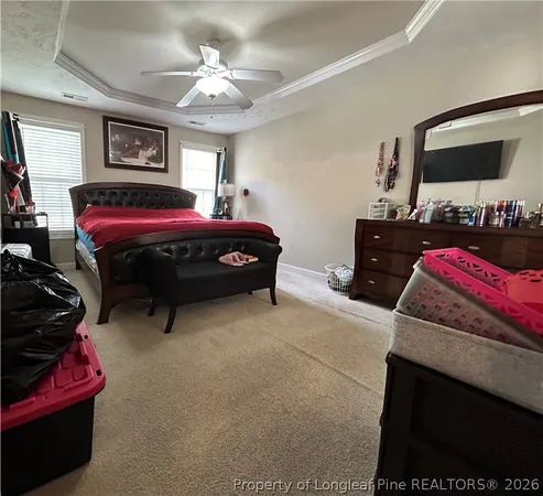 a bedroom with a bed and a tv