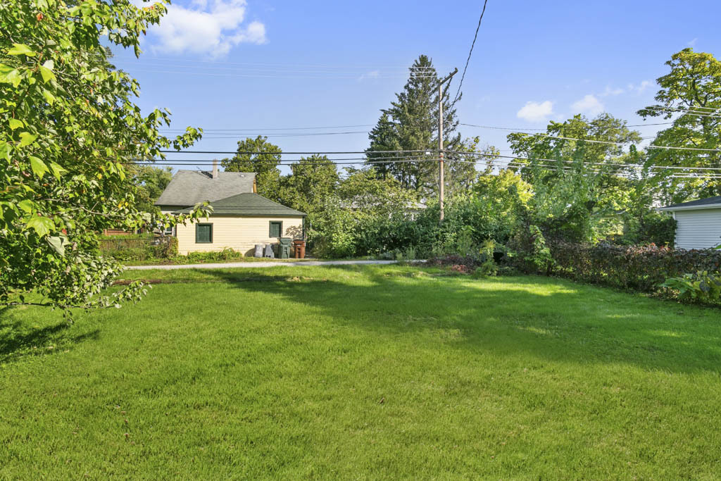 1914 Evergreen Road Homewood, IL 60430 - Photo 17 of 18 a front view of a house with a yard