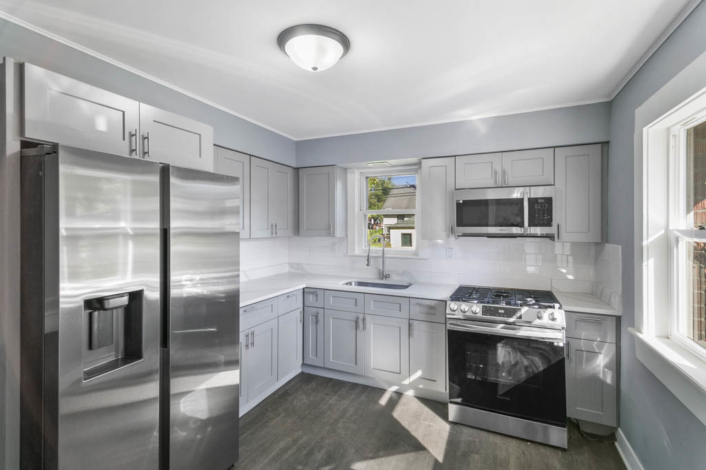 1914 Evergreen Road Homewood, IL 60430 - Photo 2 of 18 a kitchen with stainless steel appliances granite countertop a stove and a refrigerator
