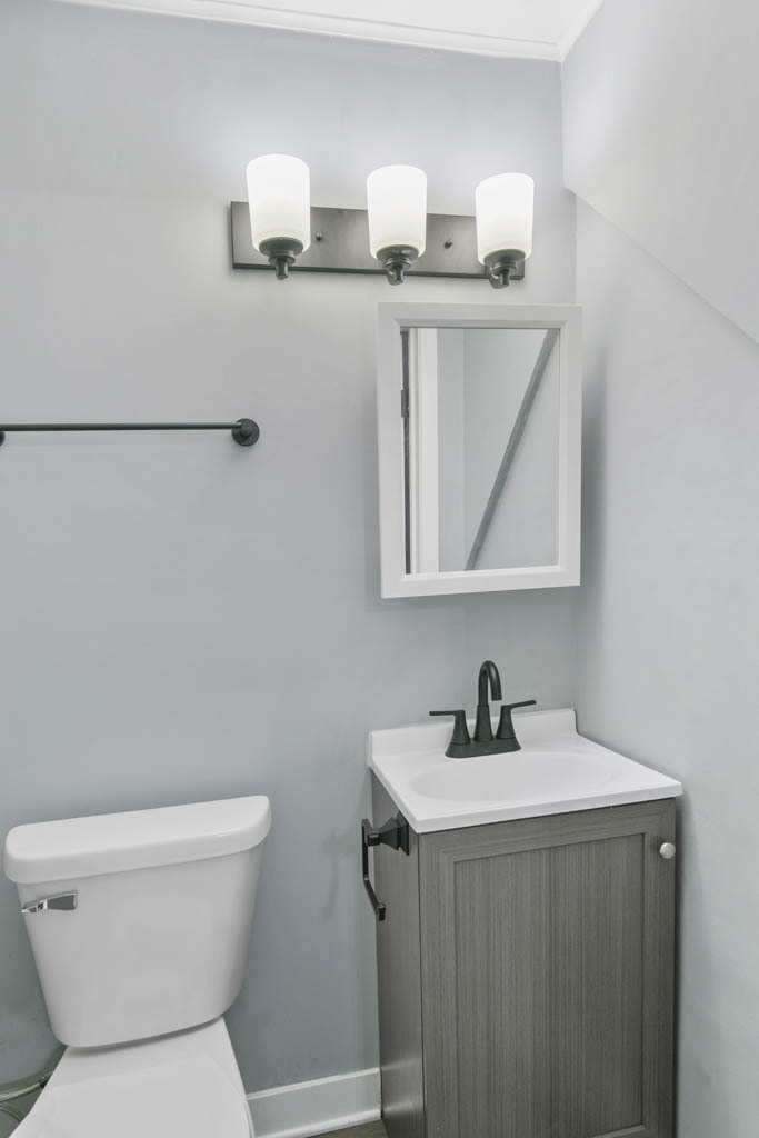 1914 Evergreen Road Homewood, IL 60430 - Photo 4 of 18 a bathroom with a toilet sink and mirror