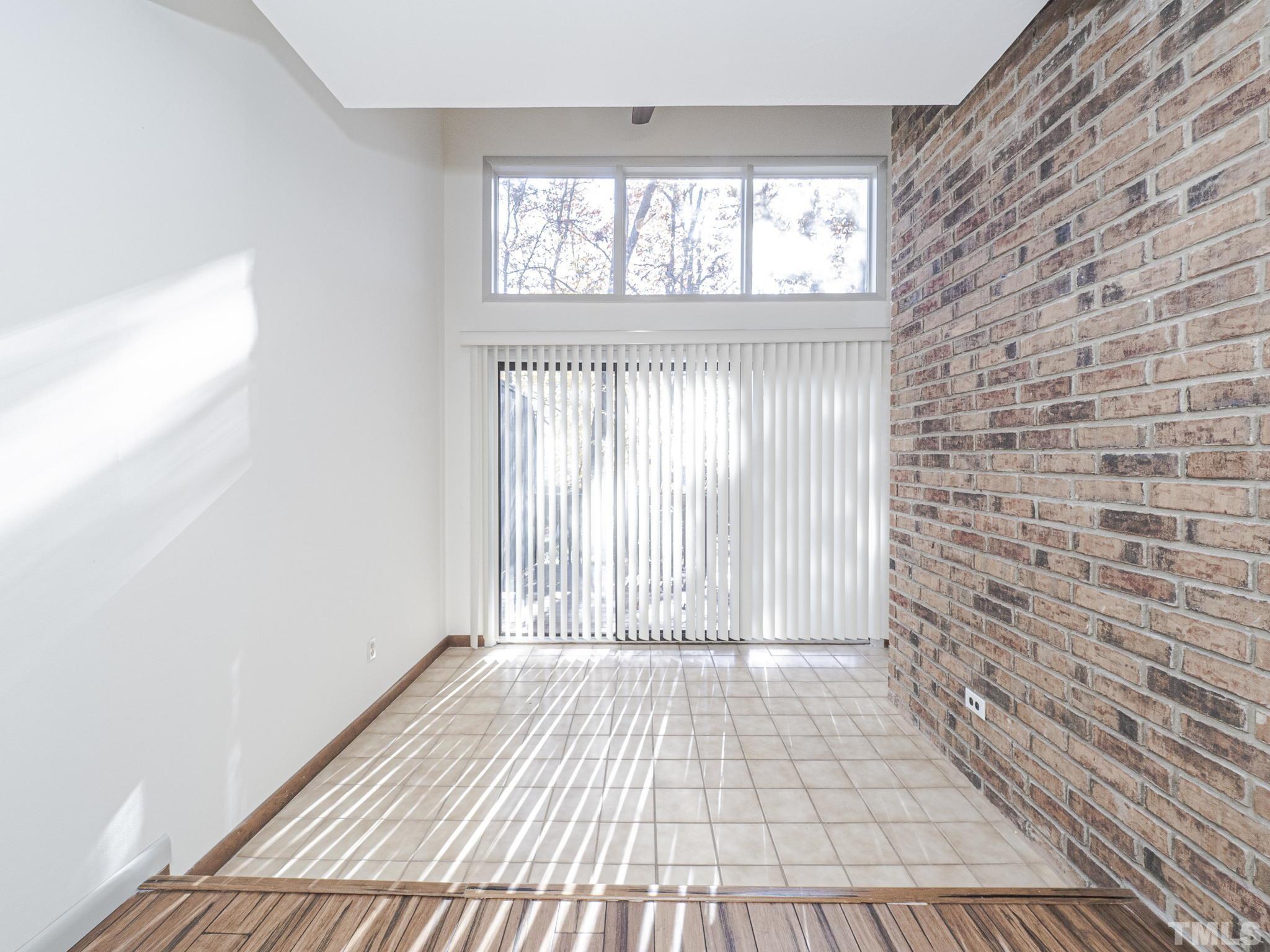 4349 Sunscape Lane Raleigh, NC 27613 - Photo 11 of 28 a view of empty room with wooden floor and fan