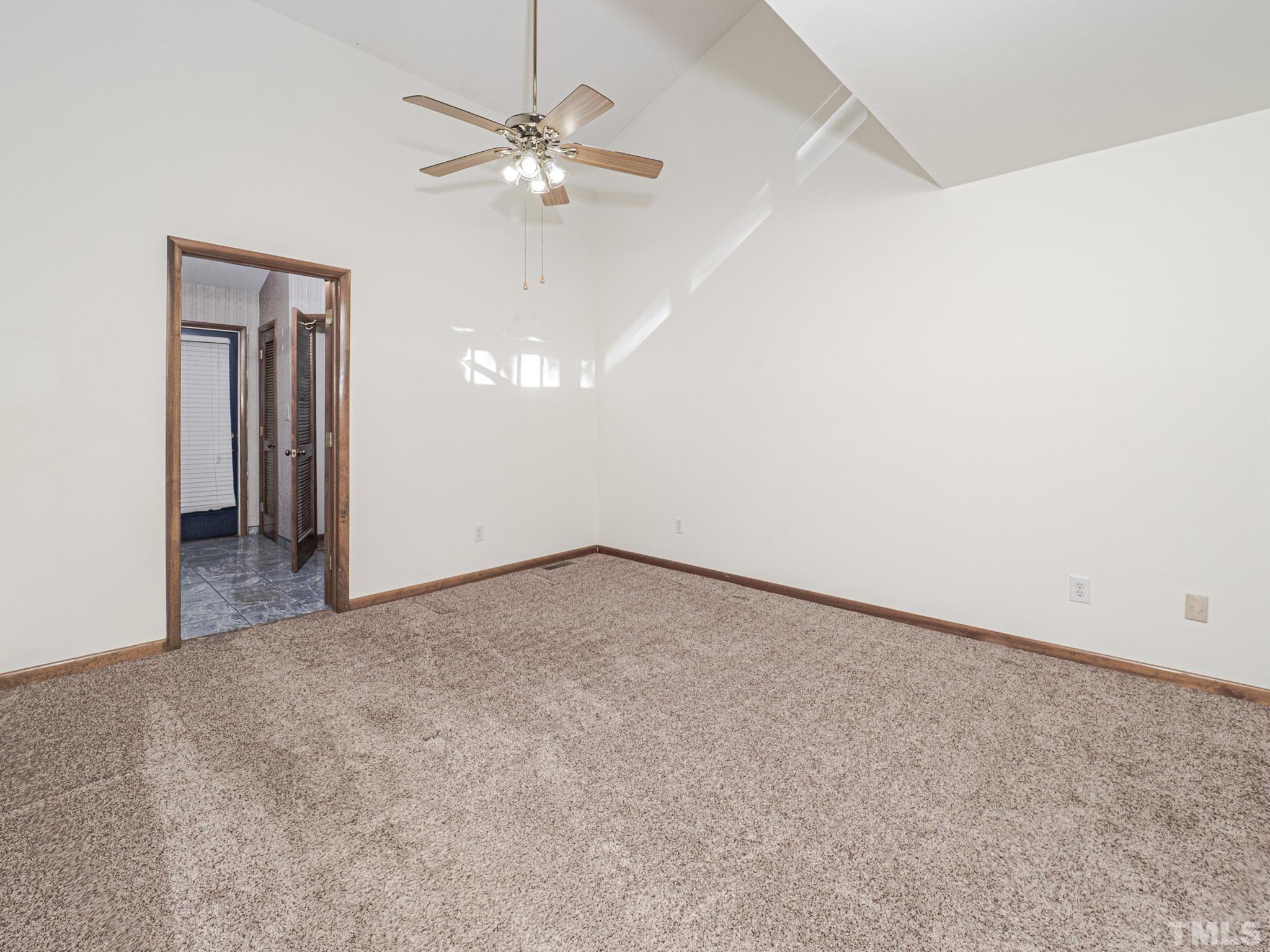 4349 Sunscape Lane Raleigh, NC 27613 - Photo 22 of 28 an empty room with chandelier fan