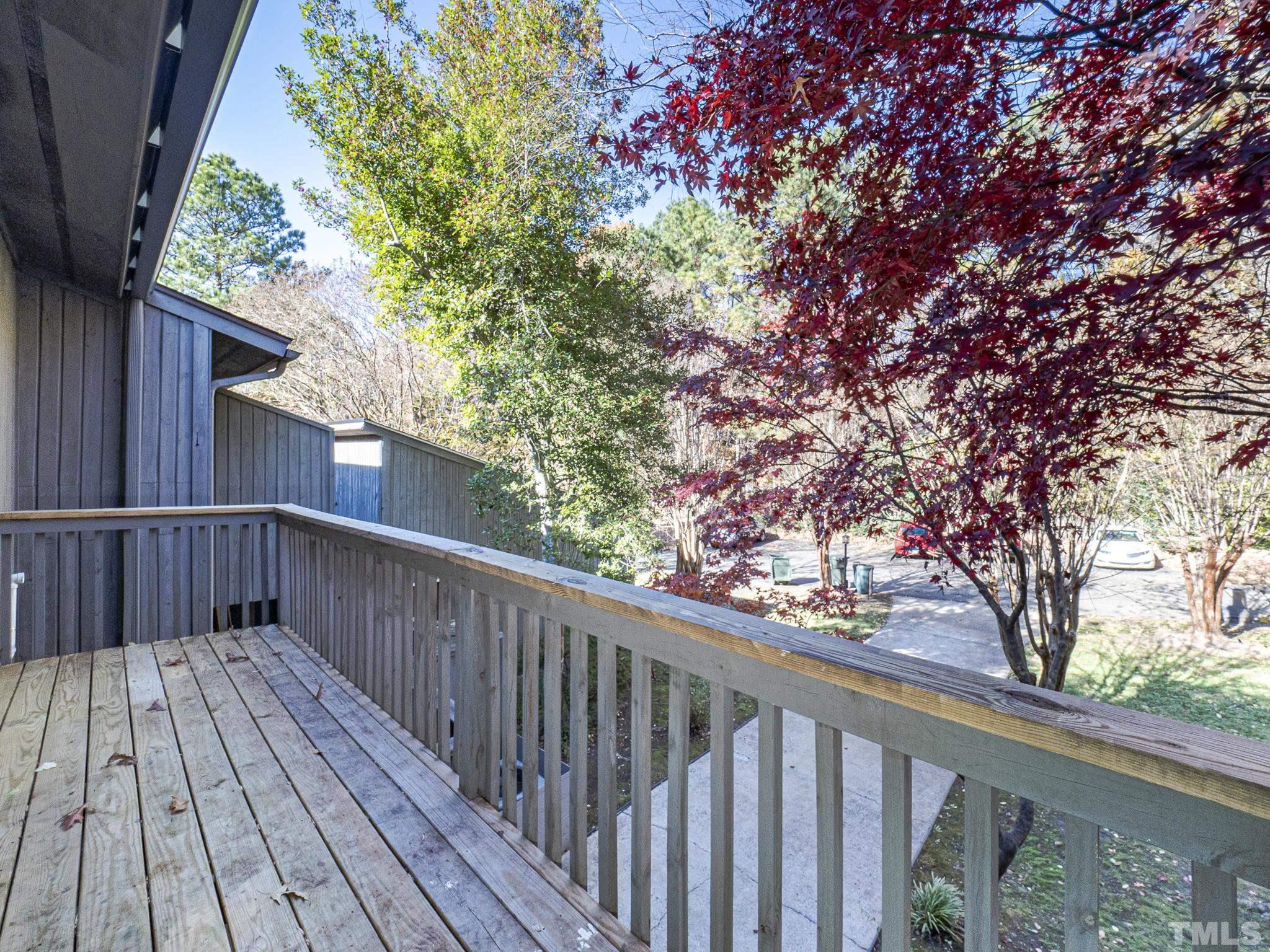4349 Sunscape Lane Raleigh, NC 27613 - Photo 27 of 28 a view of balcony with wooden floor and fence