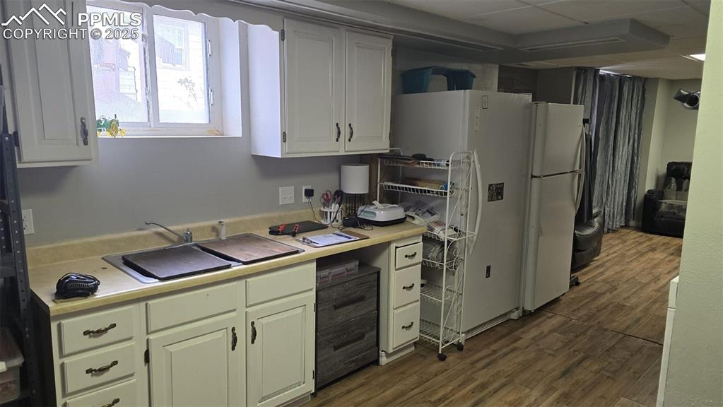 414 Seventh Street Hugo, CO 80821 - Photo 17 of 30 a kitchen with stainless steel appliances a refrigerator sink and cabinets
