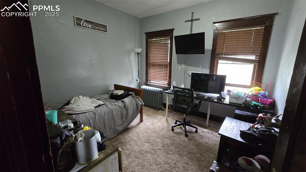 414 Seventh Street Hugo, CO 80821 - Photo 23 of 30 a room with furniture and a flat screen tv