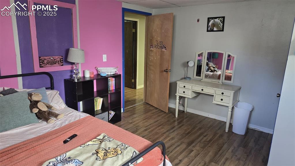 414 Seventh Street Hugo, CO 80821 - Photo 24 of 30 a bed room with a bed and a dresser