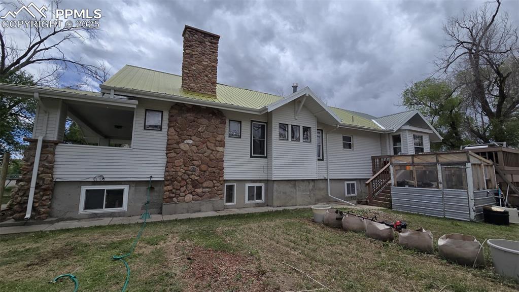 414 Seventh Street Hugo, CO 80821 - Photo 26 of 30 a front view of a house with garden