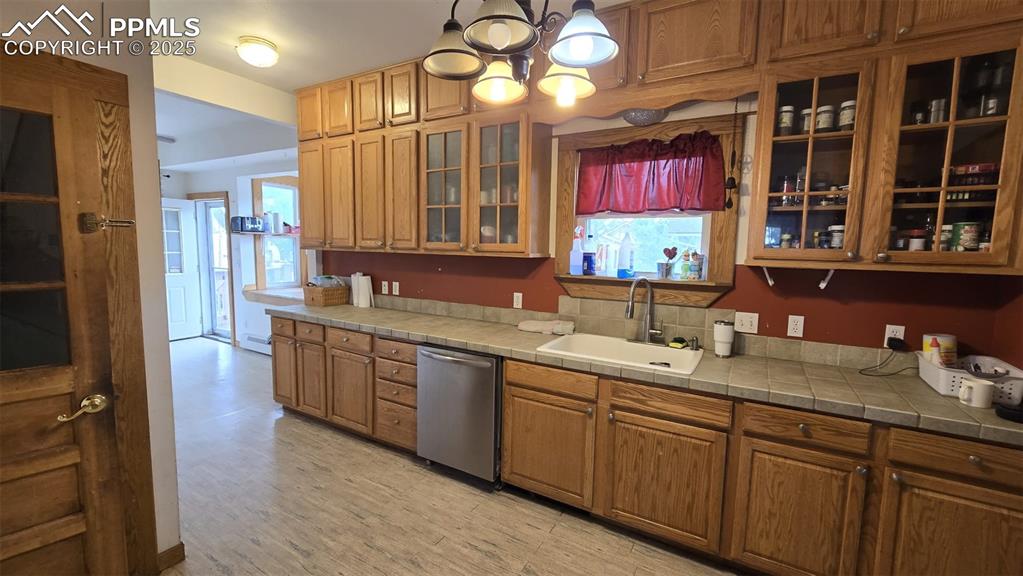 414 Seventh Street Hugo, CO 80821 - Photo 9 of 30 a kitchen with a sink cabinets and window