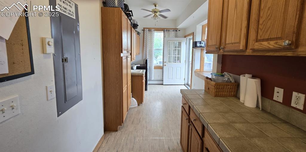 414 Seventh Street Hugo, CO 80821 - Photo 10 of 30 a hallway with dining area and chandelier