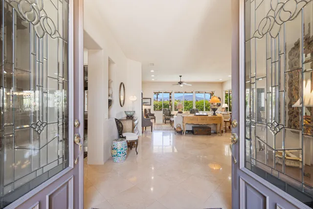 a view of living room with furniture and floor to ceiling window