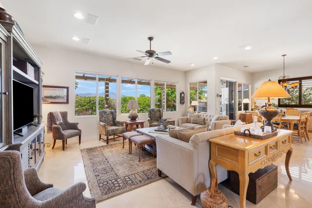 a living room with fireplace furniture and a flat screen tv