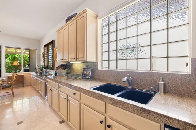 a kitchen with a sink and a window