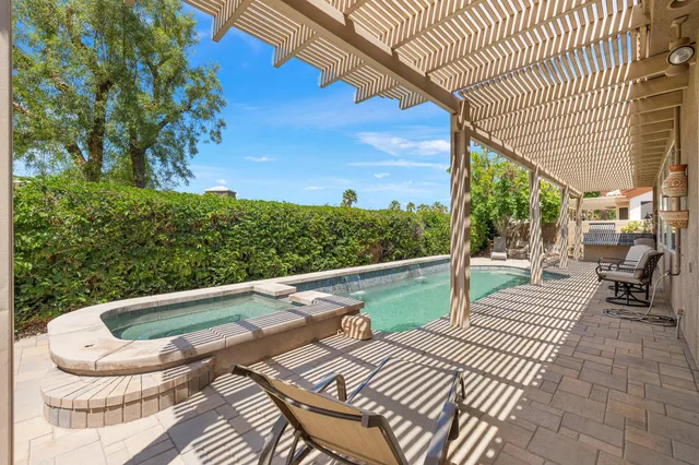 a view of swimming pool from a balcony