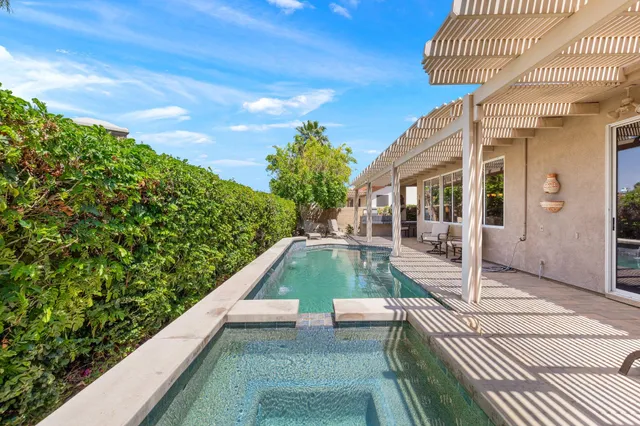 a view of balcony with two potted plants