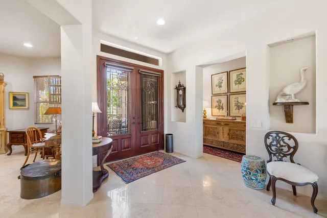 a bedroom with furniture and a potted plant