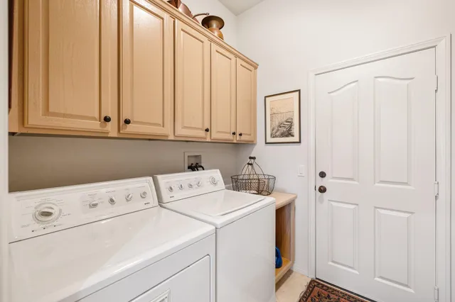 a view of storage and utility room with washer and dryer