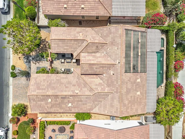 a view of a house with a yard and sitting area