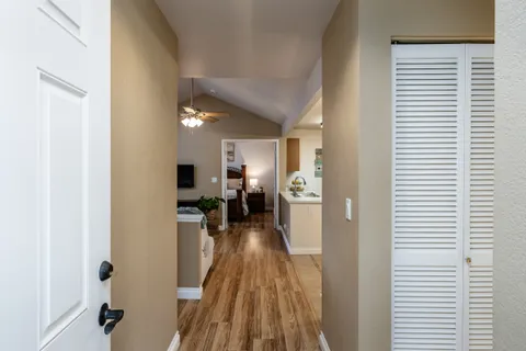 a view of a living room and bathroom with a sink
