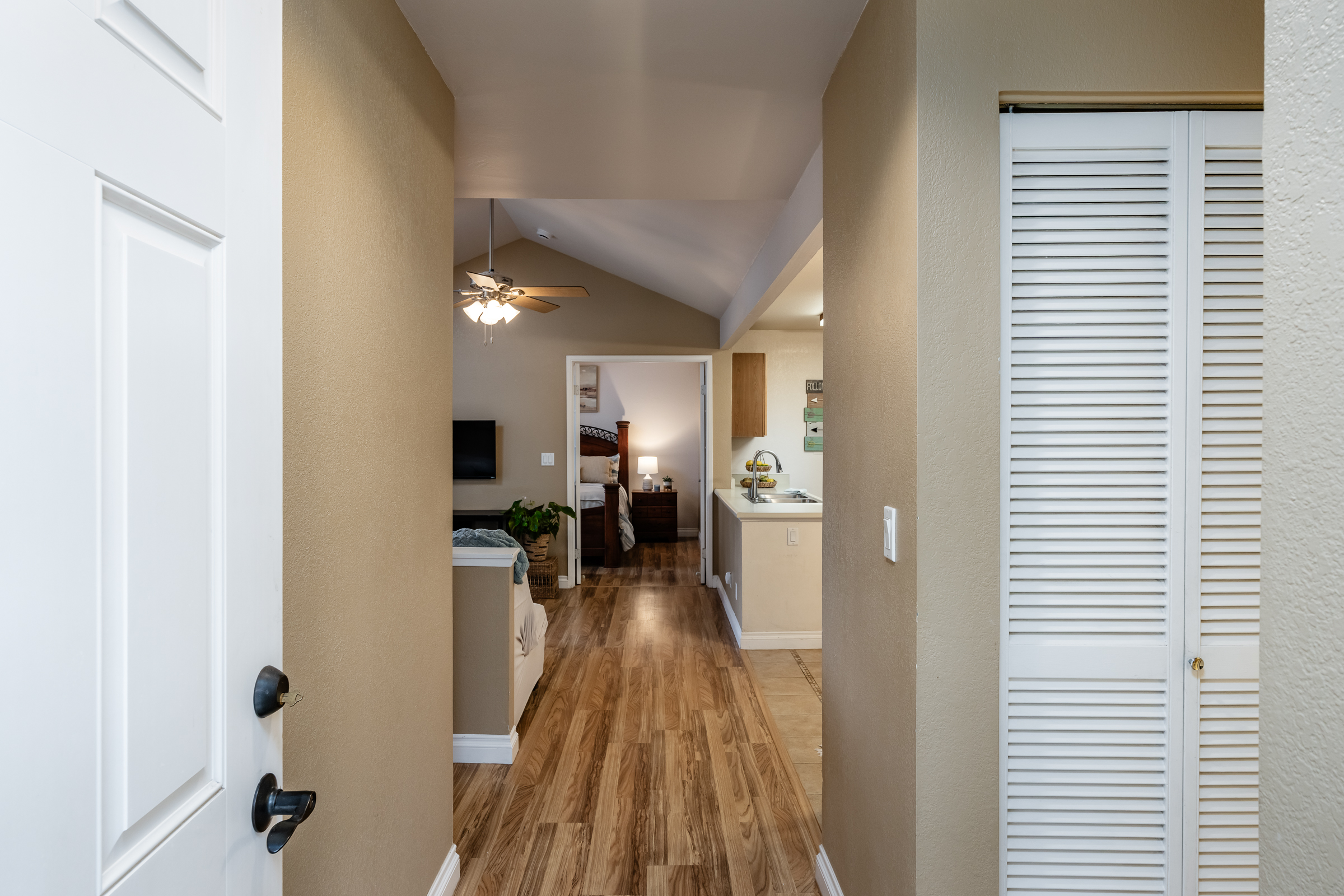 68-3883 Lua Kula Street, Unit 2106 Waikoloa, HI 96738 - Photo 11 of 13 a view of a living room and bathroom with a sink