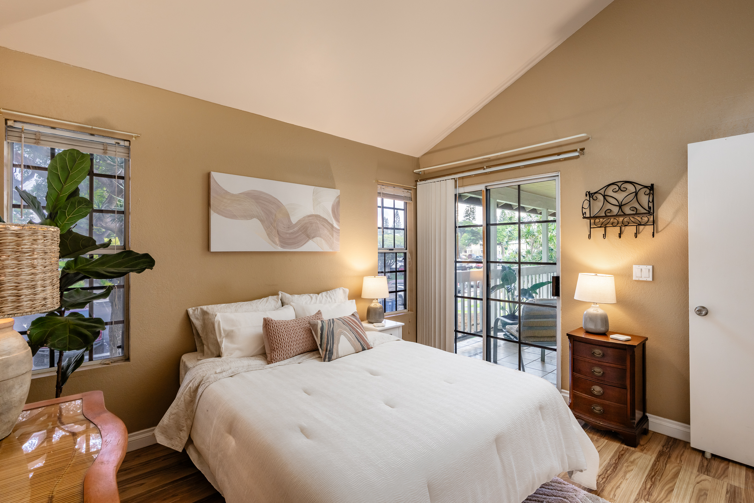 68-3883 Lua Kula Street, Unit 2106 Waikoloa, HI 96738 - Photo 7 of 13 a bedroom with a bed and wooden floor