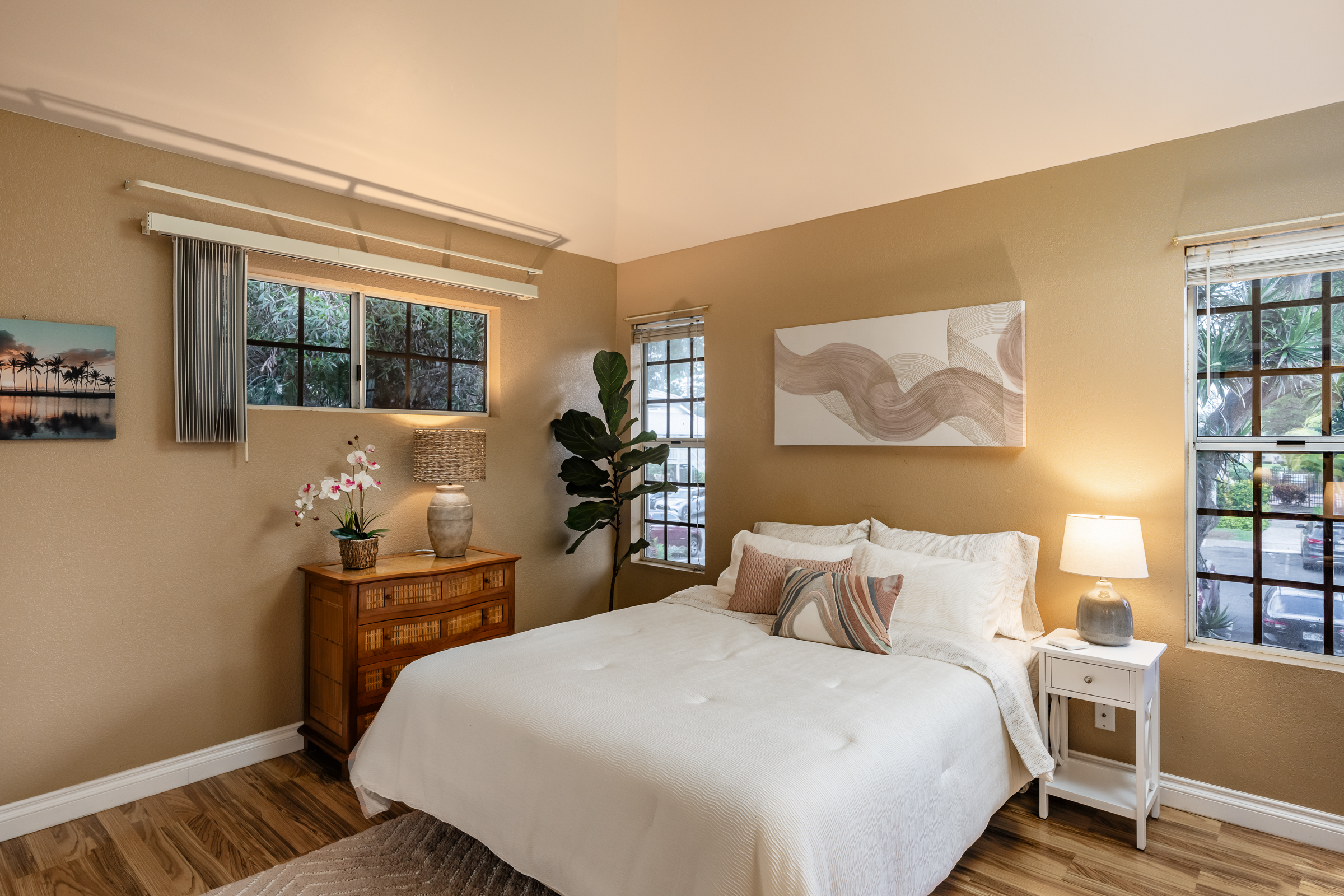 68-3883 Lua Kula Street, Unit 2106 Waikoloa, HI 96738 - Photo 8 of 13 a bedroom with a bed and wooden floor