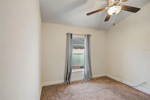 an empty room with fan