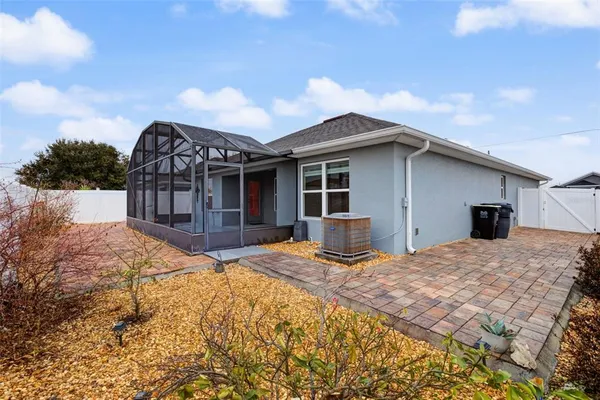 a view of a house with snow on the side of the road