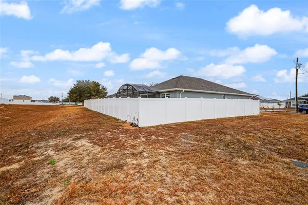 a view of a big yard with a house