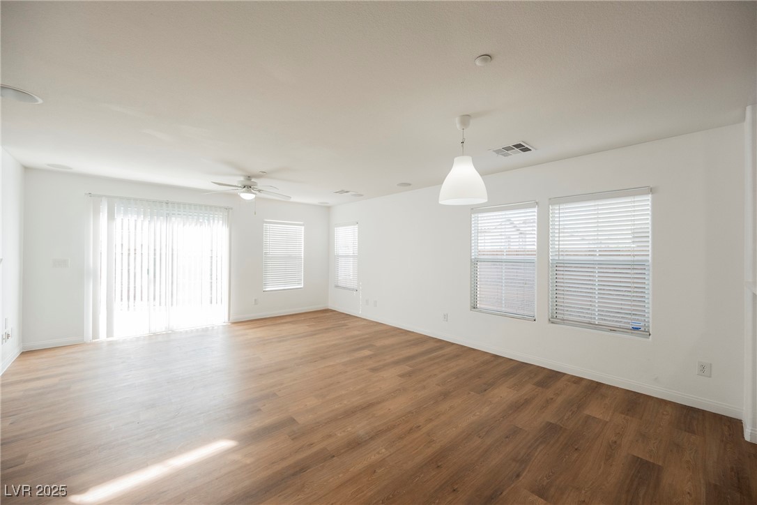 1161 Gecko Road Henderson, NV 89002 - Photo 25 of 54 Unfurnished room with wood finished floors and a ceiling fan