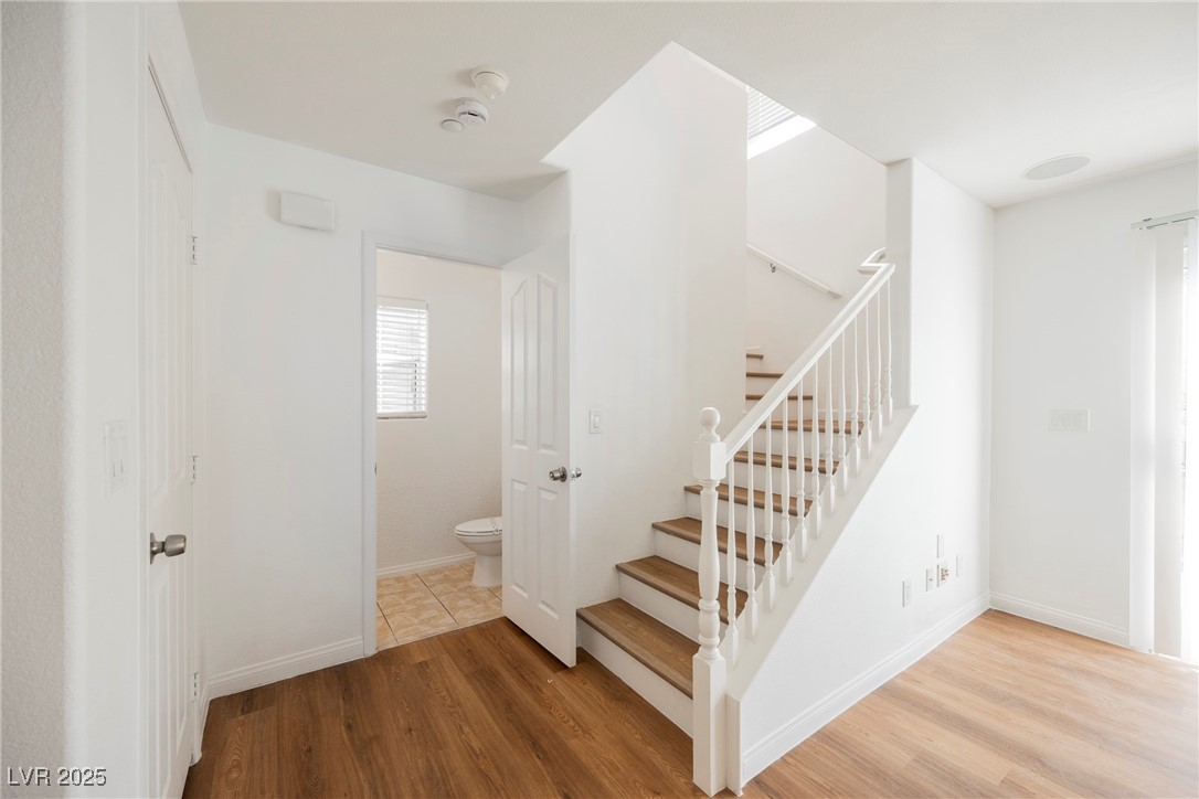 1161 Gecko Road Henderson, NV 89002 - Photo 28 of 54 Stairs featuring wood finished floors and baseboards