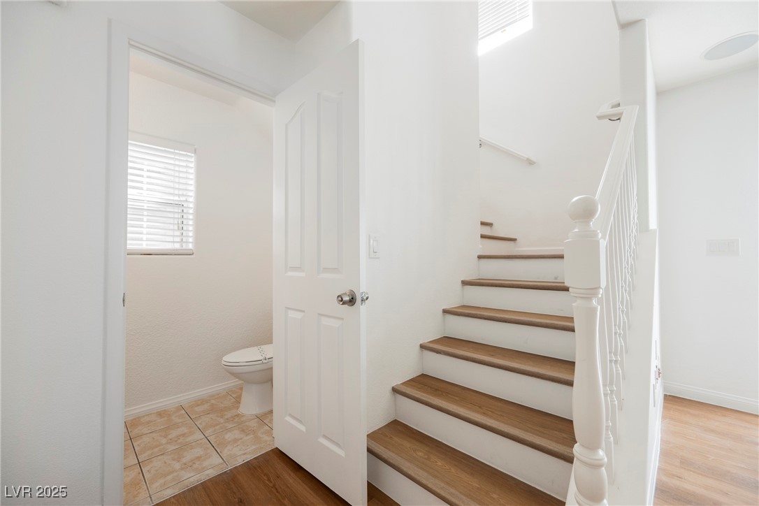 1161 Gecko Road Henderson, NV 89002 - Photo 29 of 54 Stairway featuring wood finished floors and baseboards