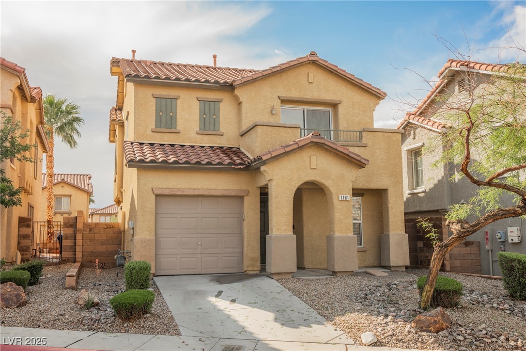 1161 Gecko Road Henderson, NV 89002 - Photo 3 of 54 Mediterranean / spanish-style house featuring a tile roof, stucco siding, a garage, a gate, and driveway
