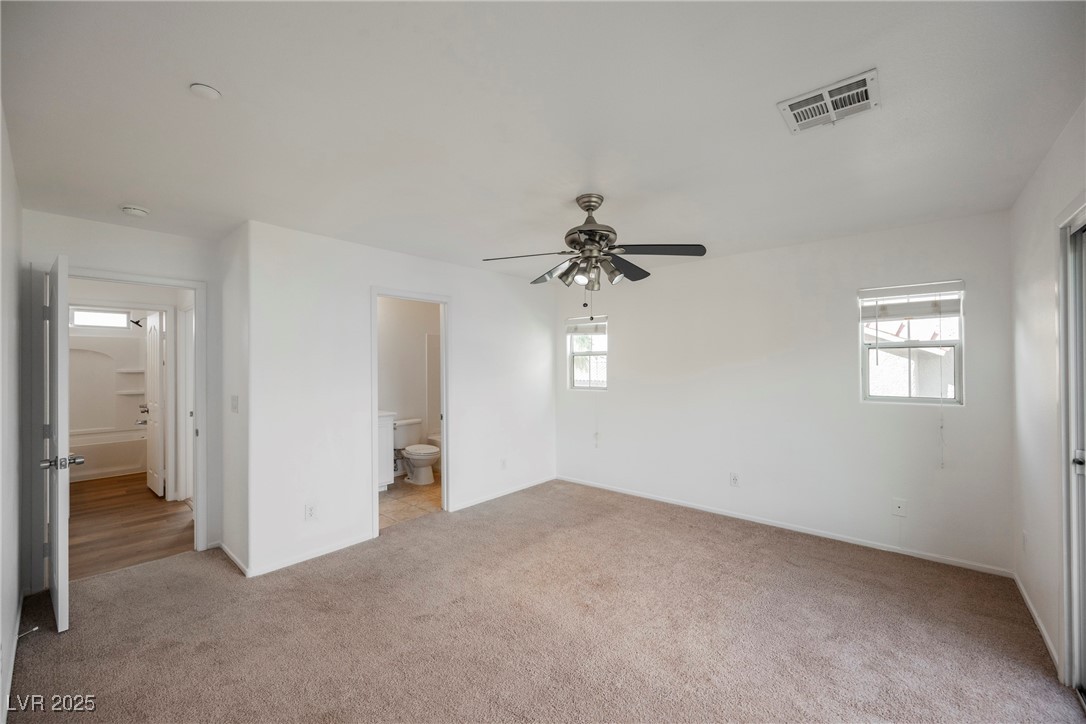 1161 Gecko Road Henderson, NV 89002 - Photo 32 of 54 Unfurnished bedroom with light colored carpet and ensuite bathroom