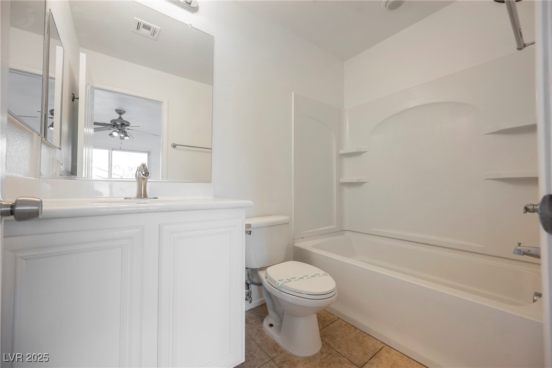 1161 Gecko Road Henderson, NV 89002 - Photo 34 of 54 Bathroom with tile patterned floors, vanity, shower / tub combination, and a ceiling fan