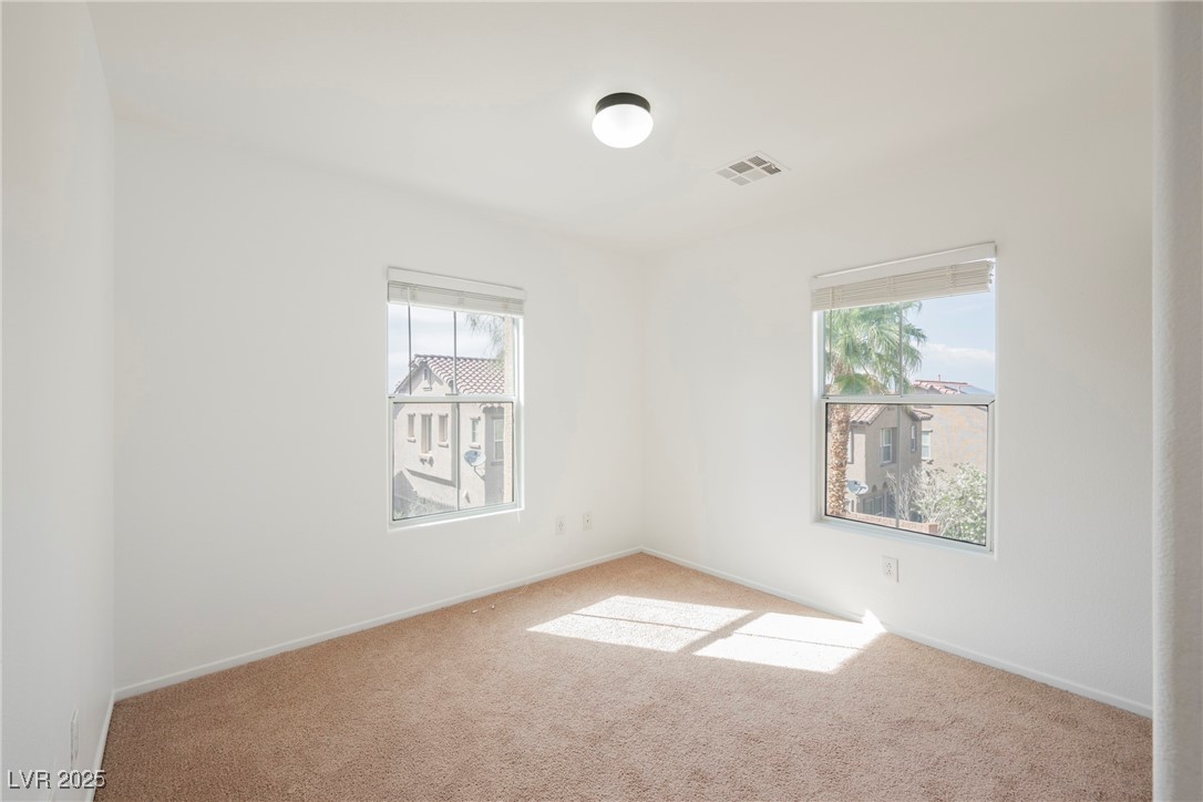 1161 Gecko Road Henderson, NV 89002 - Photo 40 of 54 Spare room featuring carpet floors and baseboards